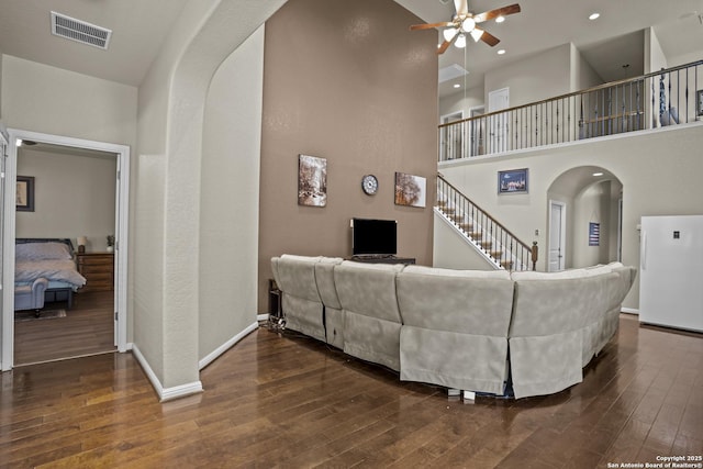 11734 Violet Cv, San Antonio, TX 78253 - living area with ceiling fan, hardwood / wood-style floors, arched walkways, recessed lighting, and baseboards