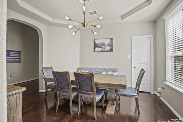 11734 Violet Cv, San Antonio, TX 78253 - dining area featuring arched walkways, hardwood / wood-style floors, a chandelier, and baseboards