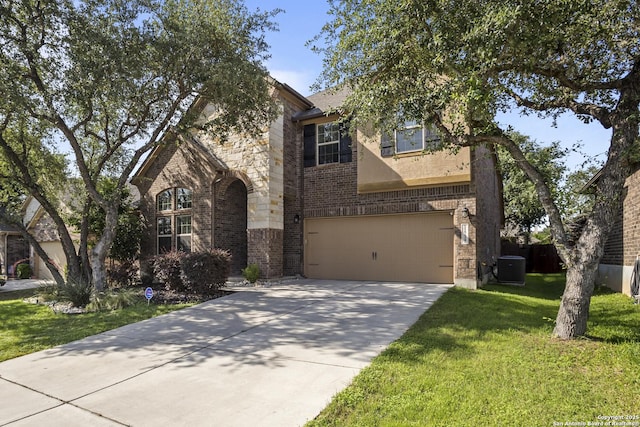11734 Violet Cv, San Antonio, TX 78253 - view of front of property with brick siding, a garage, central AC unit, concrete driveway, and a front yard