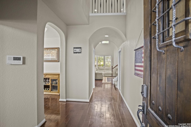 11734 Violet Cv, San Antonio, TX 78253 - corridor featuring hardwood / wood-style floors, arched walkways, and baseboards