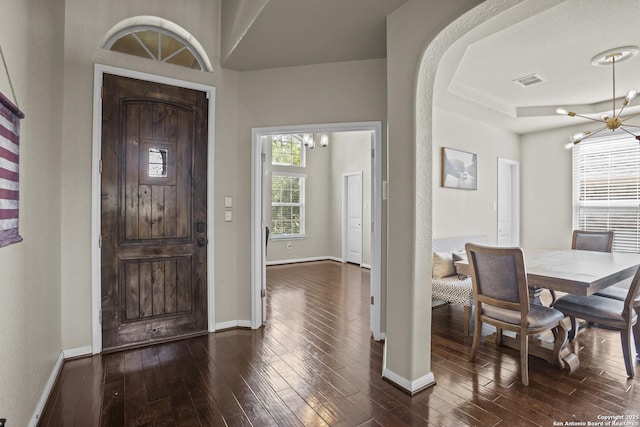 11734 Violet Cv, San Antonio, TX 78253 - foyer entrance featuring a chandelier, dark wood-style flooring, and baseboards