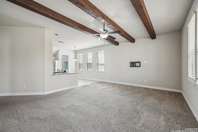 11526 Lily Blair, San Antonio, TX 78253 - unfurnished living room featuring a ceiling fan, carpet floors, baseboards, and beam ceiling