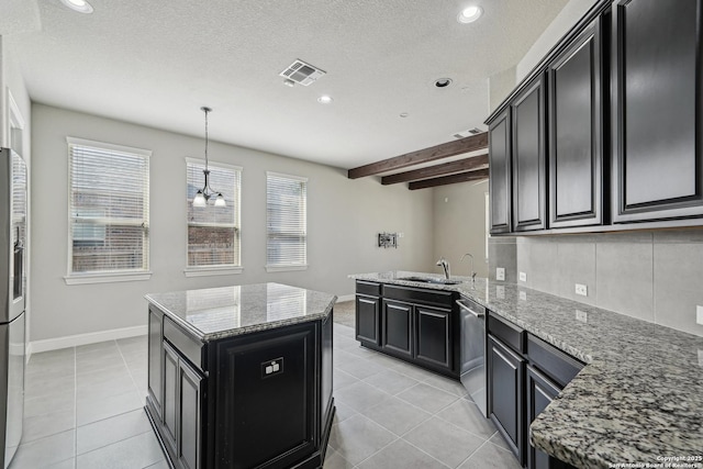 11526 Lily Blair, San Antonio, TX 78253 - kitchen featuring stainless steel appliances, dark cabinets, a sink, a kitchen island, and light tile patterned flooring