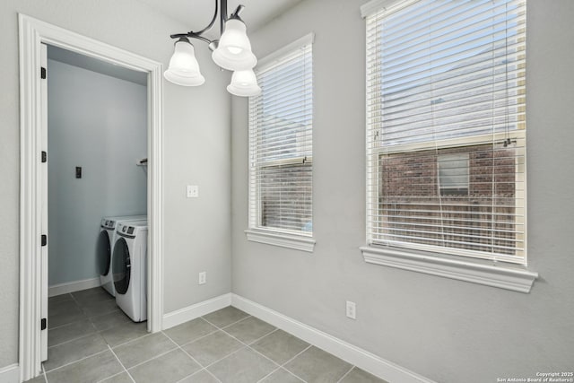 11526 Lily Blair, San Antonio, TX 78253 - laundry room with washing machine and dryer, tile patterned flooring, baseboards, and a chandelier