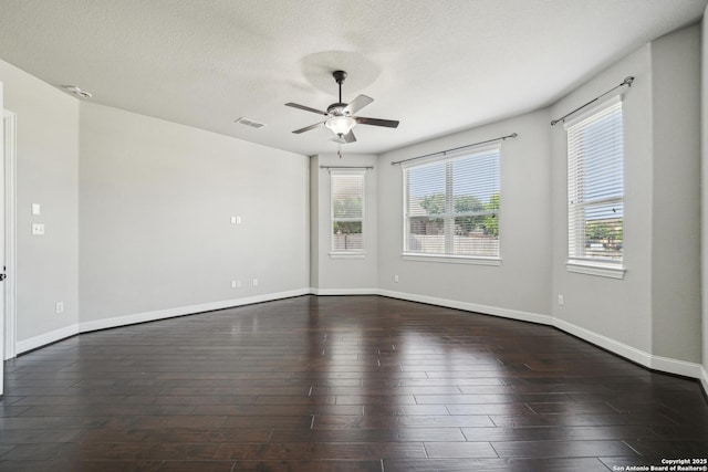 11526 Lily Blair, San Antonio, TX 78253 - empty room with a ceiling fan, dark wood-style floors, baseboards, and a textured ceiling