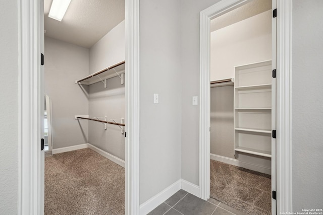 11526 Lily Blair, San Antonio, TX 78253 - walk in closet featuring dark colored carpet and dark tile patterned floors