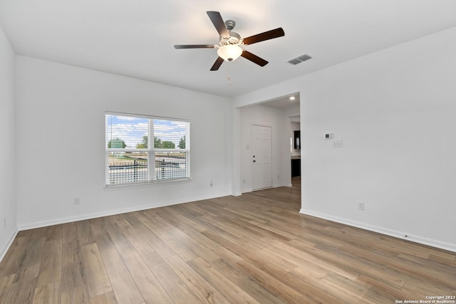 10827 Quinn Ct, San Antonio, TX 78252 - unfurnished room featuring a ceiling fan, light wood finished floors, and baseboards