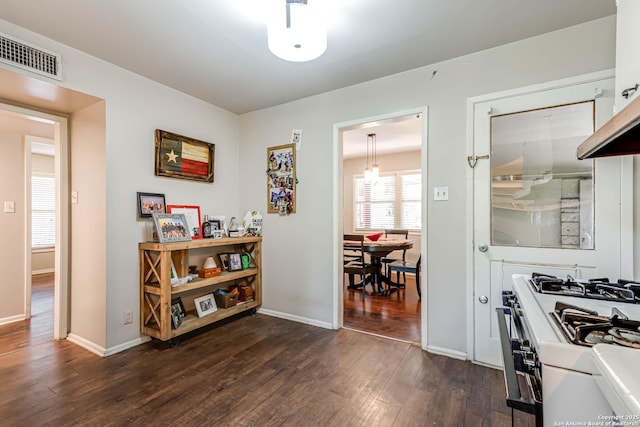 2027 Edgehill Dr, San Antonio, TX 78209 - hallway with dark wood-type flooring and baseboards