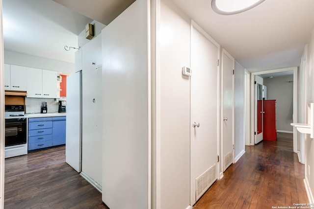 2027 Edgehill Dr, San Antonio, TX 78209 - hallway with dark wood-style floors and baseboards