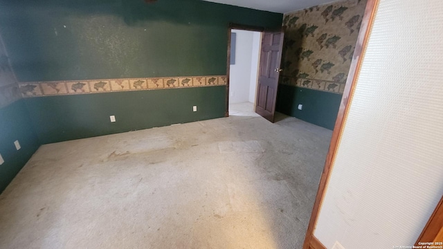 7 Glen Cove Dr, Seguin, TX 78155 - unfurnished bedroom with wallpapered walls and carpet flooring