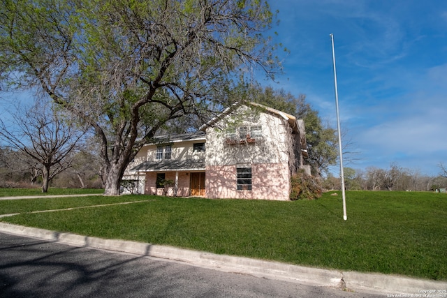 7 Glen Cove Dr, Seguin, TX 78155 - view of property exterior with a lawn and brick siding