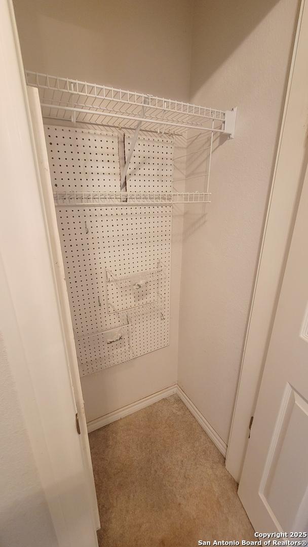 7 Glen Cove Dr, Seguin, TX 78155 - walk in closet featuring light colored carpet