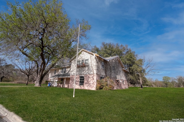 7 Glen Cove Dr, Seguin, TX 78155 - view of side of property featuring a lawn and brick siding