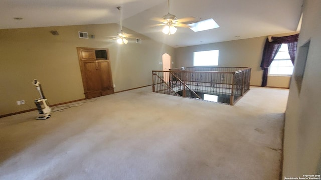 7 Glen Cove Dr, Seguin, TX 78155 - additional living space with baseboards, vaulted ceiling, ceiling fan, arched walkways, and a skylight