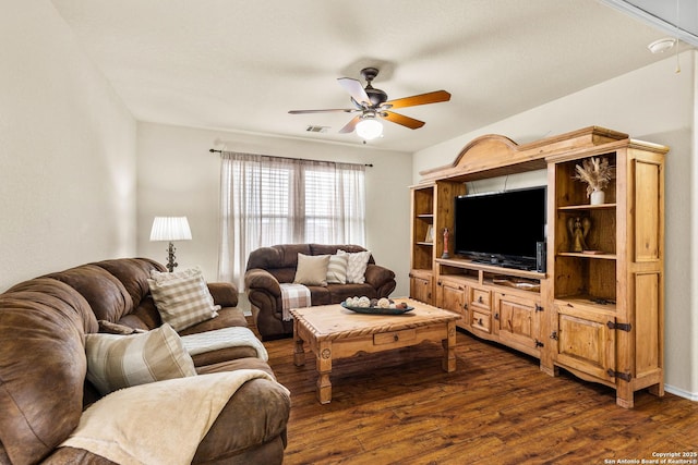 living room featuring ceiling fan and dark wood finished floors