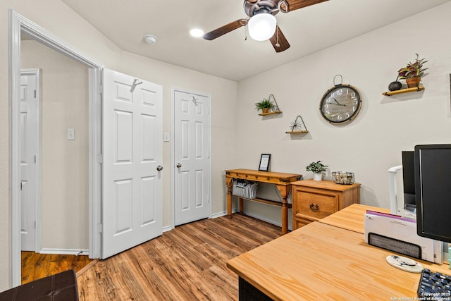 office with ceiling fan, wood finished floors, and baseboards