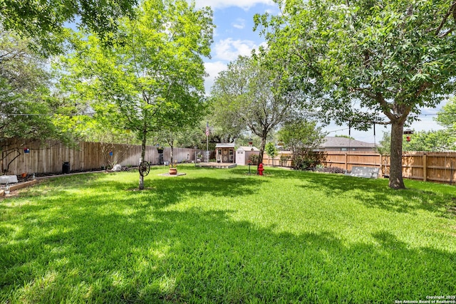 view of yard with an outbuilding and a storage shed