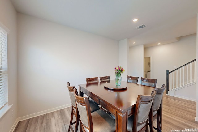 10259 Juniper Oaks, Boerne, TX 78006 - dining space featuring light wood-type flooring, healthy amount of natural light, stairs, baseboards, and recessed lighting