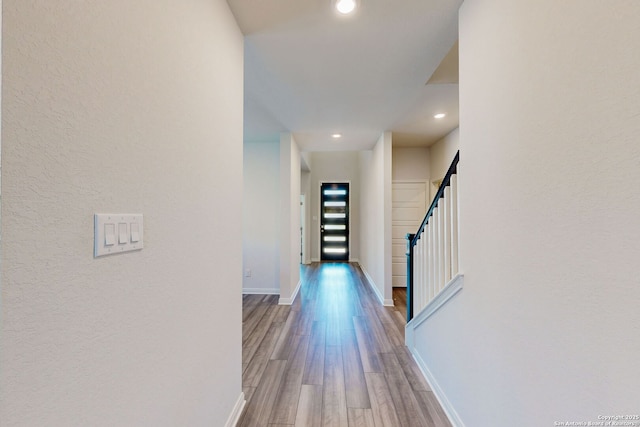 10259 Juniper Oaks, Boerne, TX 78006 - corridor with wood finished floors, baseboards, recessed lighting, and stairway