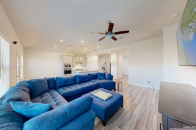 10259 Juniper Oaks, Boerne, TX 78006 - living area featuring light wood-type flooring, a ceiling fan, baseboards, and recessed lighting