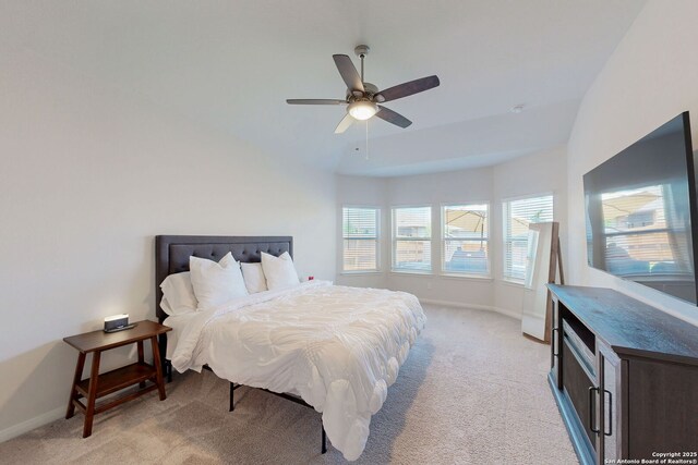 10259 Juniper Oaks, Boerne, TX 78006 - bedroom with light carpet, baseboards, vaulted ceiling, and a ceiling fan