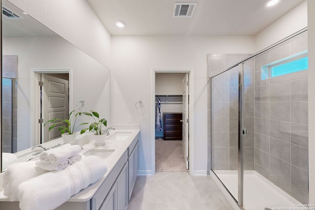 10259 Juniper Oaks, Boerne, TX 78006 - bathroom with a stall shower, tile patterned floors, double vanity, recessed lighting, and baseboards