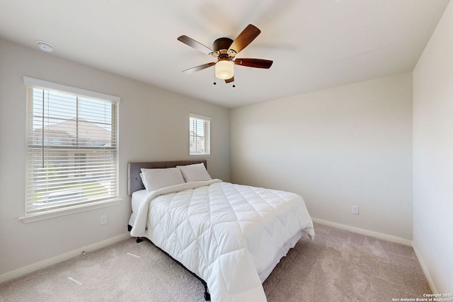 10259 Juniper Oaks, Boerne, TX 78006 - bedroom with light carpet, baseboards, and ceiling fan