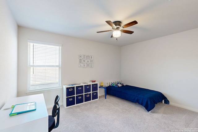 10259 Juniper Oaks, Boerne, TX 78006 - carpeted bedroom featuring multiple windows, ceiling fan, and baseboards