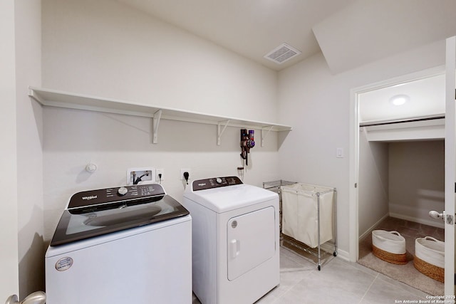 10259 Juniper Oaks, Boerne, TX 78006 - clothes washing area featuring washing machine and dryer and light tile patterned floors