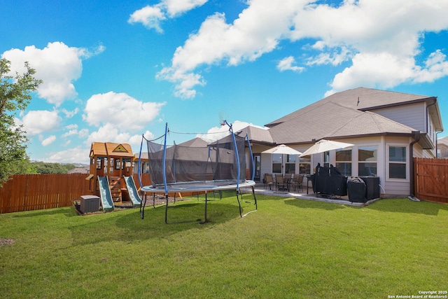 10259 Juniper Oaks, Boerne, TX 78006 - view of yard featuring a playground, a trampoline, a patio area, and central air condition unit