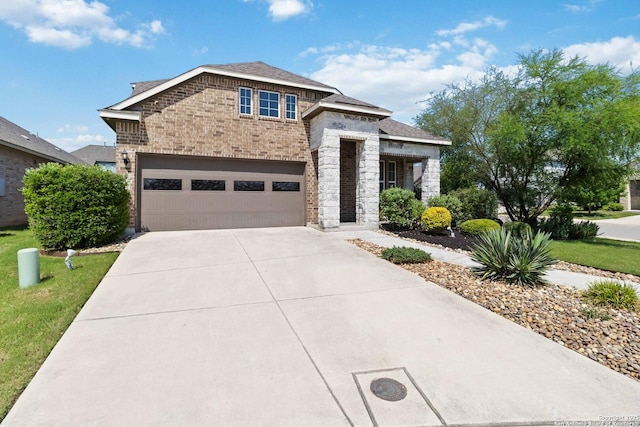 612 Wipper, New Braunfels, TX 78130 - view of front of property featuring brick siding, concrete driveway, an attached garage, stone siding, and a front lawn