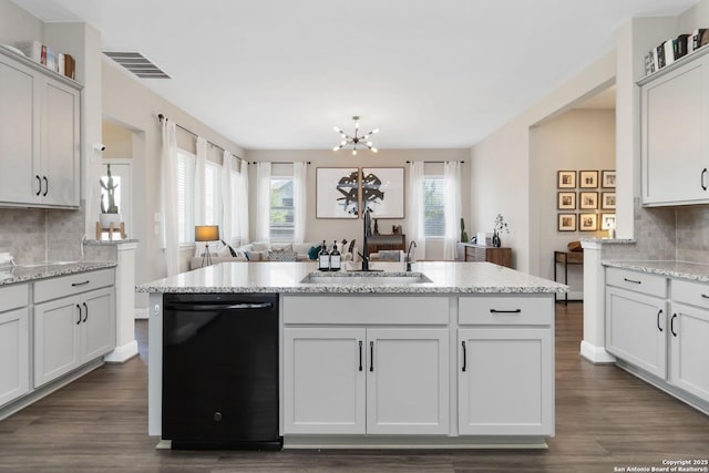 612 Wipper, New Braunfels, TX 78130 - kitchen with dishwasher, a sink, dark wood-type flooring, decorative backsplash, and a chandelier