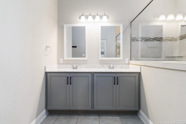 612 Wipper, New Braunfels, TX 78130 - bathroom with double vanity, baseboards, and tile patterned flooring