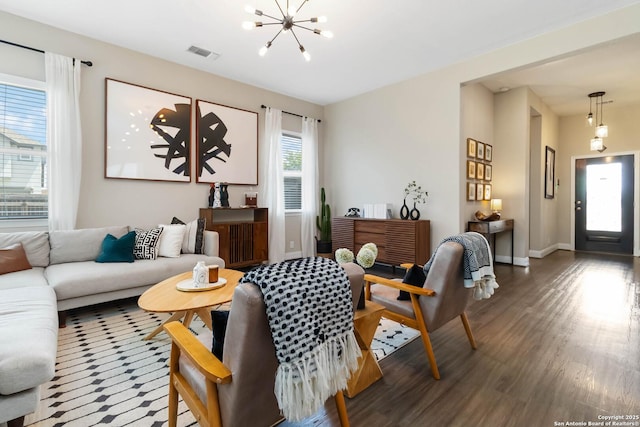 612 Wipper, New Braunfels, TX 78130 - living area featuring wood finished floors, a chandelier, and baseboards