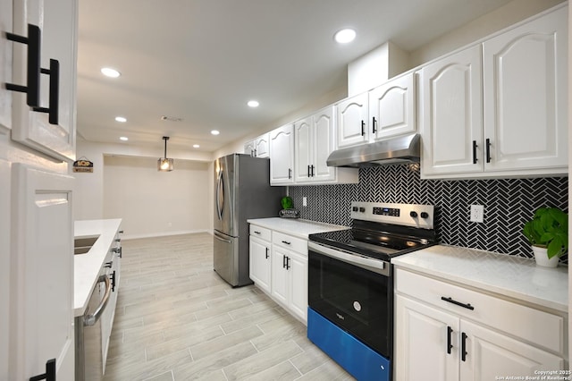 5914 Pineway, San Antonio, TX 78247 - kitchen with under cabinet range hood, appliances with stainless steel finishes, baseboards, tasteful backsplash, and white cabinetry