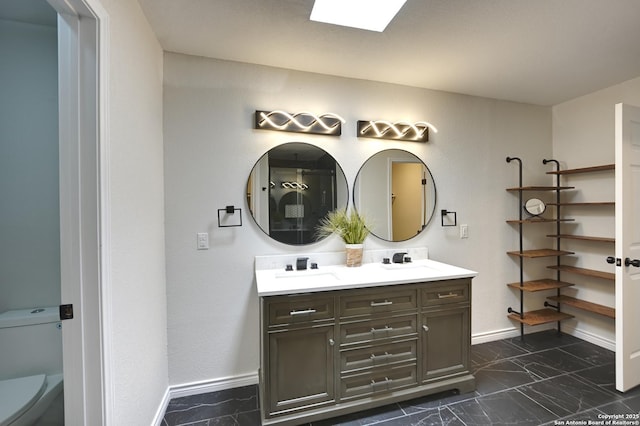 5914 Pineway, San Antonio, TX 78247 - full bathroom featuring marble look tiles, baseboards, double vanity, and toilet
