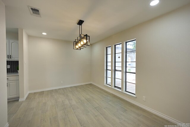 5914 Pineway, San Antonio, TX 78247 - unfurnished dining area with light wood-style flooring, recessed lighting, and baseboards