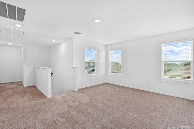 10819 Quinn Ct, San Antonio, TX 78252 - carpeted empty room featuring attic access, plenty of natural light, recessed lighting, and baseboards