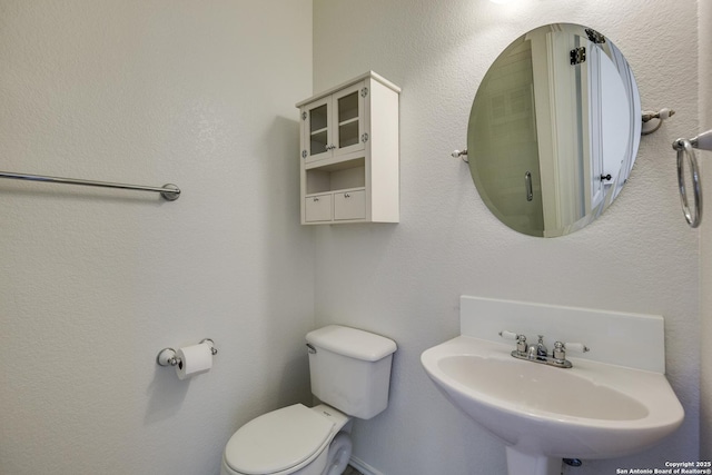 bathroom featuring a sink and toilet