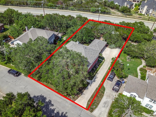aerial view of residential area with property boundaries highlighted