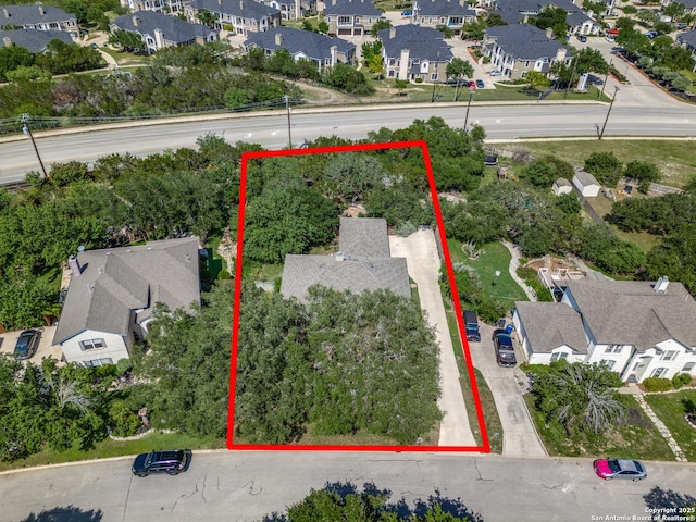 aerial view of residential area featuring property boundaries highlighted