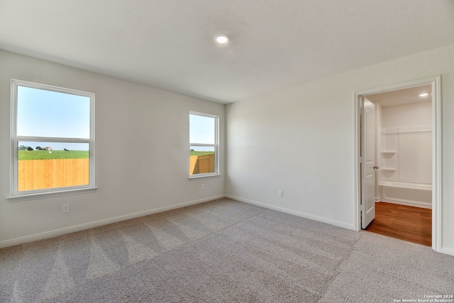 11920 Stroud Dr, San Antonio, TX 78252 - unfurnished bedroom with carpet flooring, baseboards, and recessed lighting