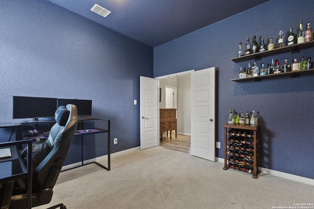 133 Edinburgh, Boerne, TX 78015 - carpeted home office with a dry bar, baseboards, a textured wall, and lofted ceiling