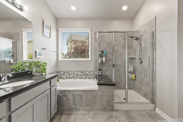 133 Edinburgh, Boerne, TX 78015 - bathroom with a shower stall, a bath, and vanity