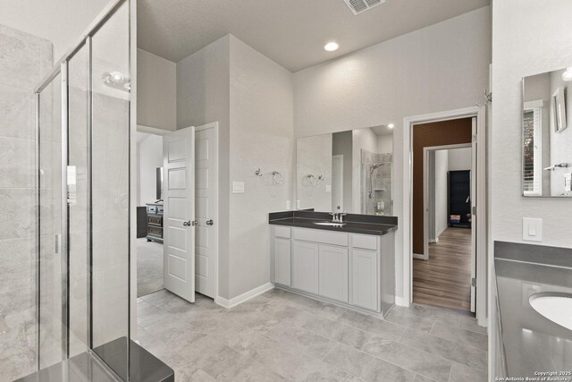 133 Edinburgh, Boerne, TX 78015 - full bath featuring a stall shower, vanity, and baseboards