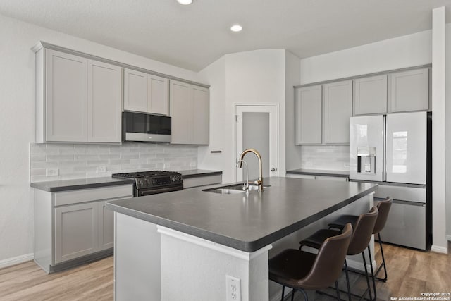 133 Edinburgh, Boerne, TX 78015 - kitchen featuring appliances with stainless steel finishes, gray cabinets, dark countertops, and recessed lighting