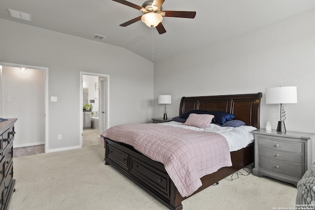 133 Edinburgh, Boerne, TX 78015 - bedroom with light carpet, vaulted ceiling, baseboards, a ceiling fan, and connected bathroom