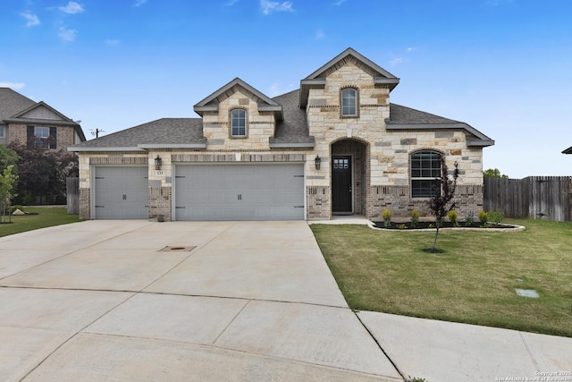 133 Edinburgh, Boerne, TX 78015 - french provincial home with driveway, a shingled roof, stone siding, an attached garage, and brick siding