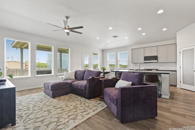 133 Edinburgh, Boerne, TX 78015 - living area featuring light wood-style flooring, a ceiling fan, recessed lighting, and baseboards