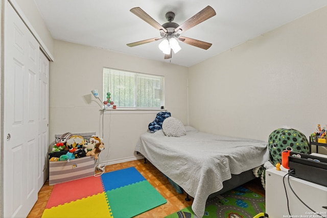 bedroom featuring a closet, ceiling fan, and baseboards